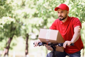 A man delivering parcel in an eBike